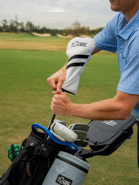 Tuube Head Cover - Golfer Putting head cover onto driver.