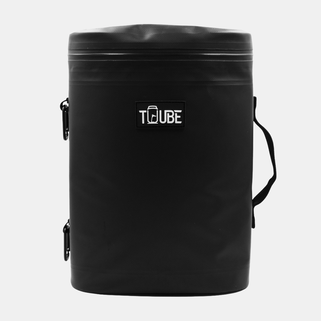 Open Tuube Weekender 8L black cooler bag loaded with 12 cans and ice, full interior visible with leakproof heat-welded inner liner