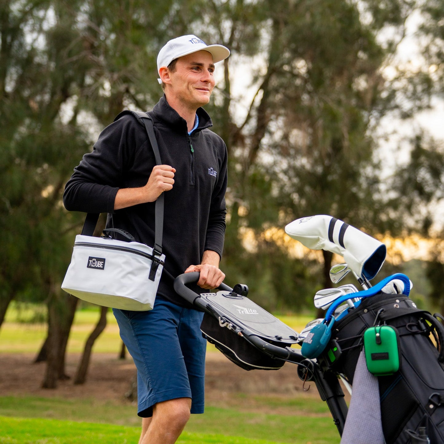 Tuube Lunch Box 6L - White - Pushing golf cart. 