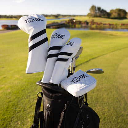 Set of Tuube head covers on driver, fairway wood and hybrid in a golf bag, showing complete club protection on a course