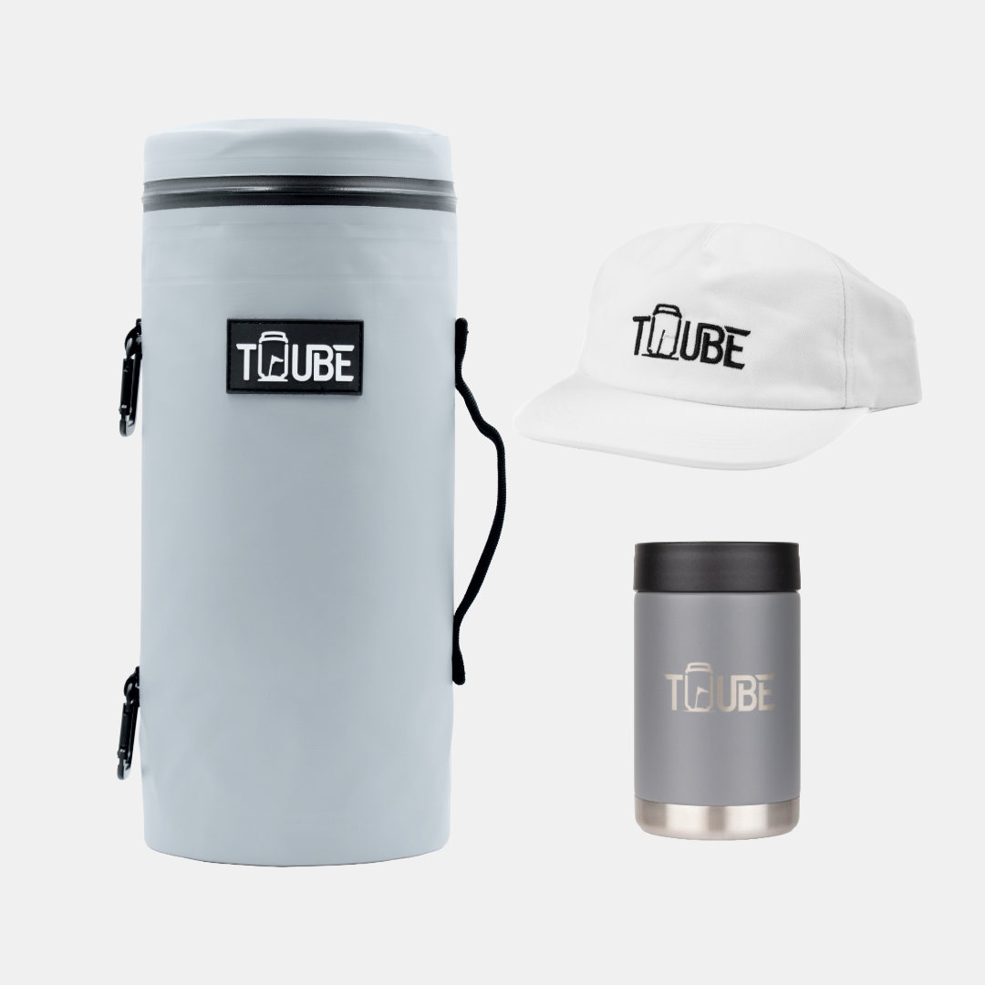 Grey Tuube Gift Bundle flat-lay showing grey Tuube 2.0 cooler bag, grey stainless steel cooler, and white hat on white background