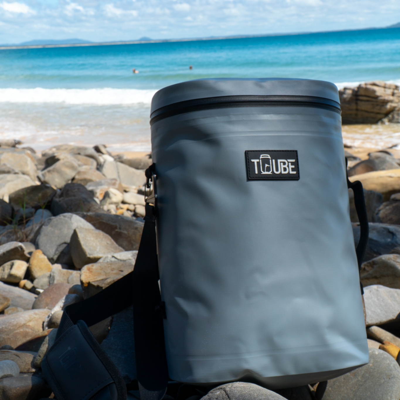 Flat lay of Tuube Weekender 8L grey insulated cooler bag open from above, showing 8L interior volume and heat-welded seam construction