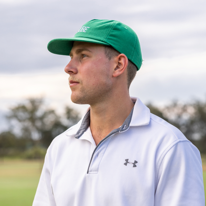 Green Tuube 5-panel hat rear view showing velcro adjustable strap and 5-panel structured crown, 100% cotton golf hat