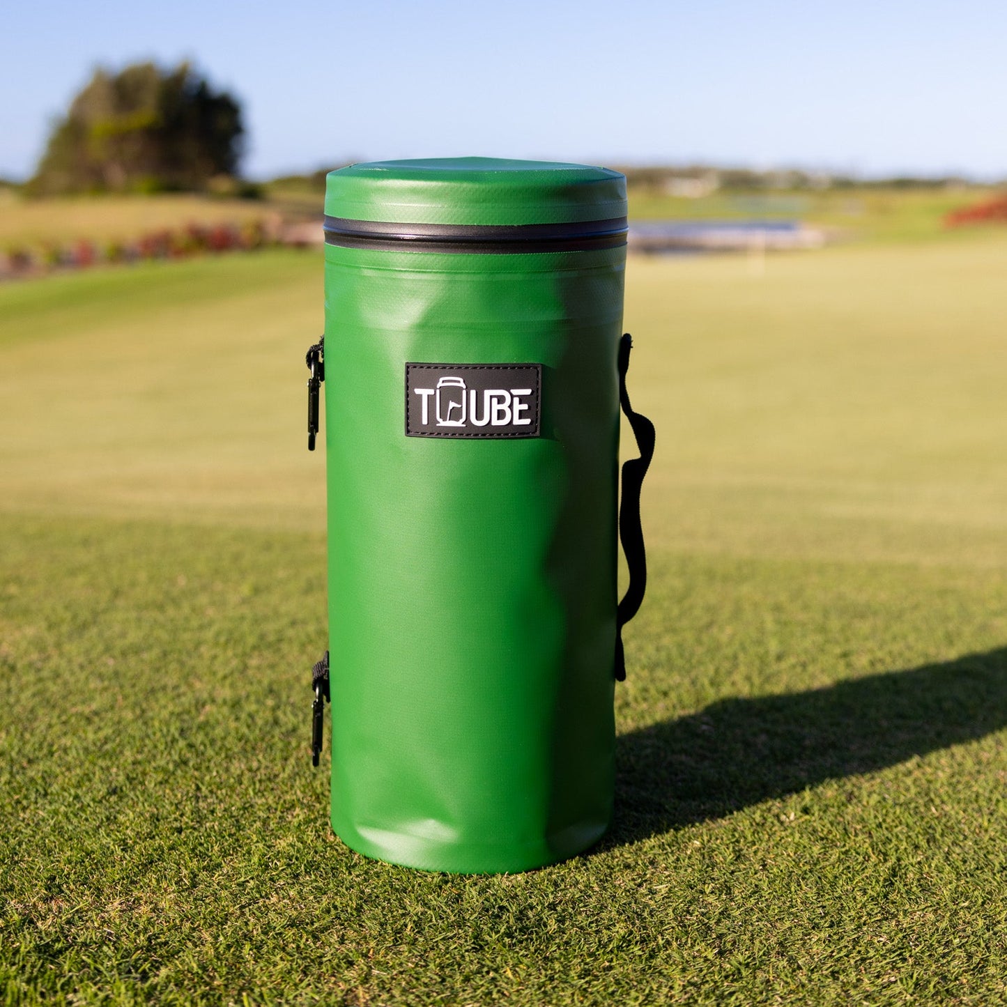 Close-up of green Tuube Cooler Bag 2.0 showing carry handle and leakproof zipper, attachable insulated golf cooler