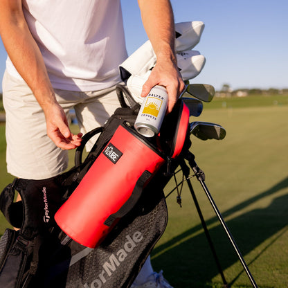 Red Tuube 2.0 cooler bag attached to a golf bag on a sunny course, standout colour choice for golfers who want to be noticed