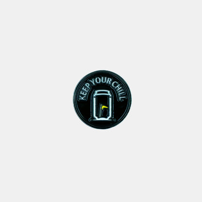 Tuube Keep Your Chill ball marker in black and grey, flat metal coated design with Tuube branding, durable golf accessory for the green