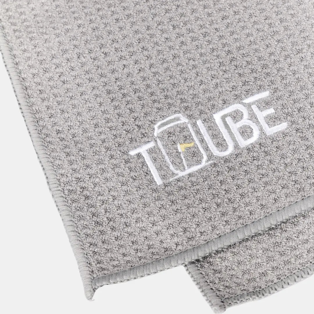 Grey Tuube microfiber clip golf towel with carabiner, attaches to any golf bag for fast club and hand cleaning between holes